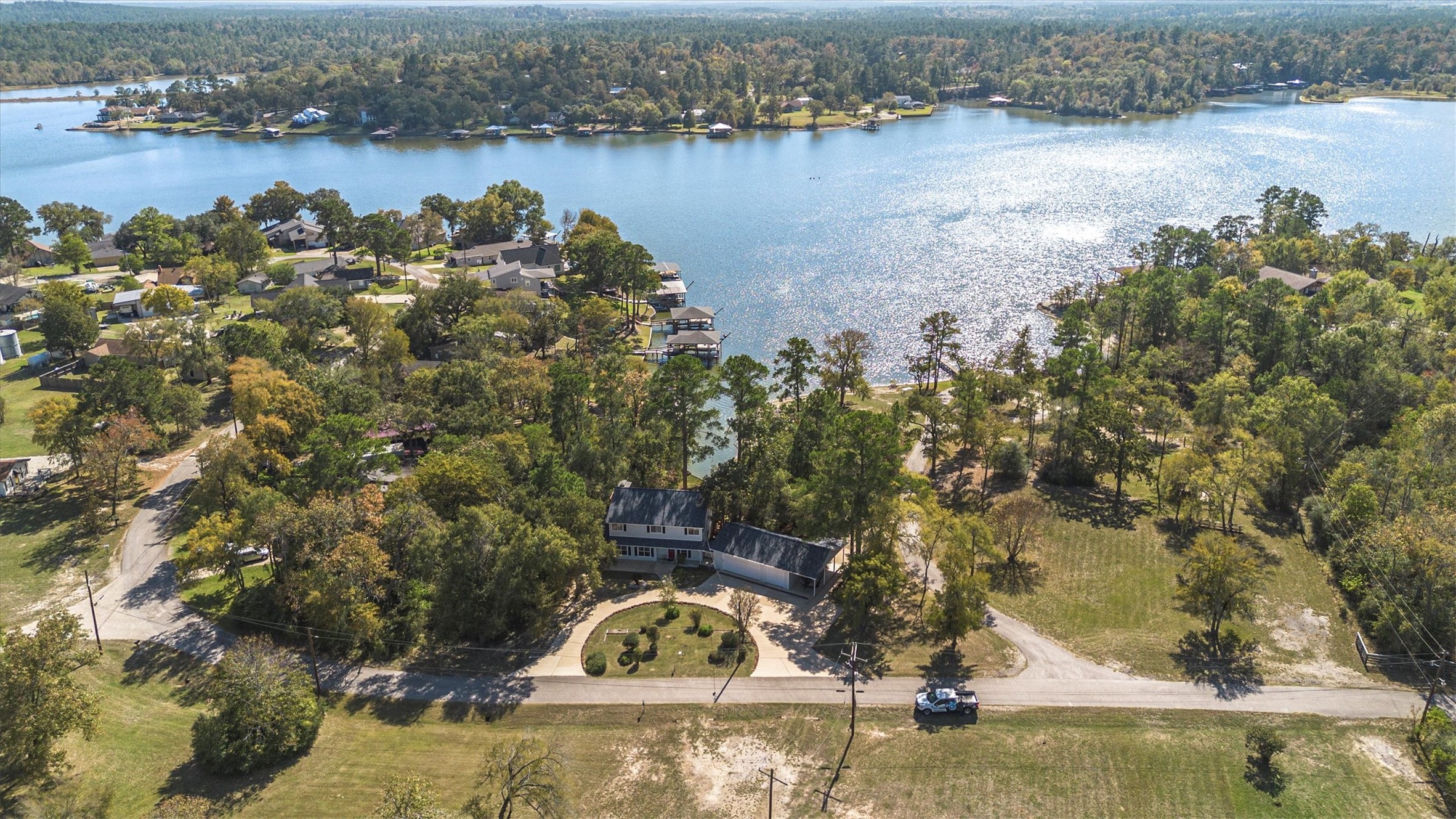 123 Palisade Circle Huntsville, TX 77320 - Photo 8 of 50 an aerial view of a house with a lake view