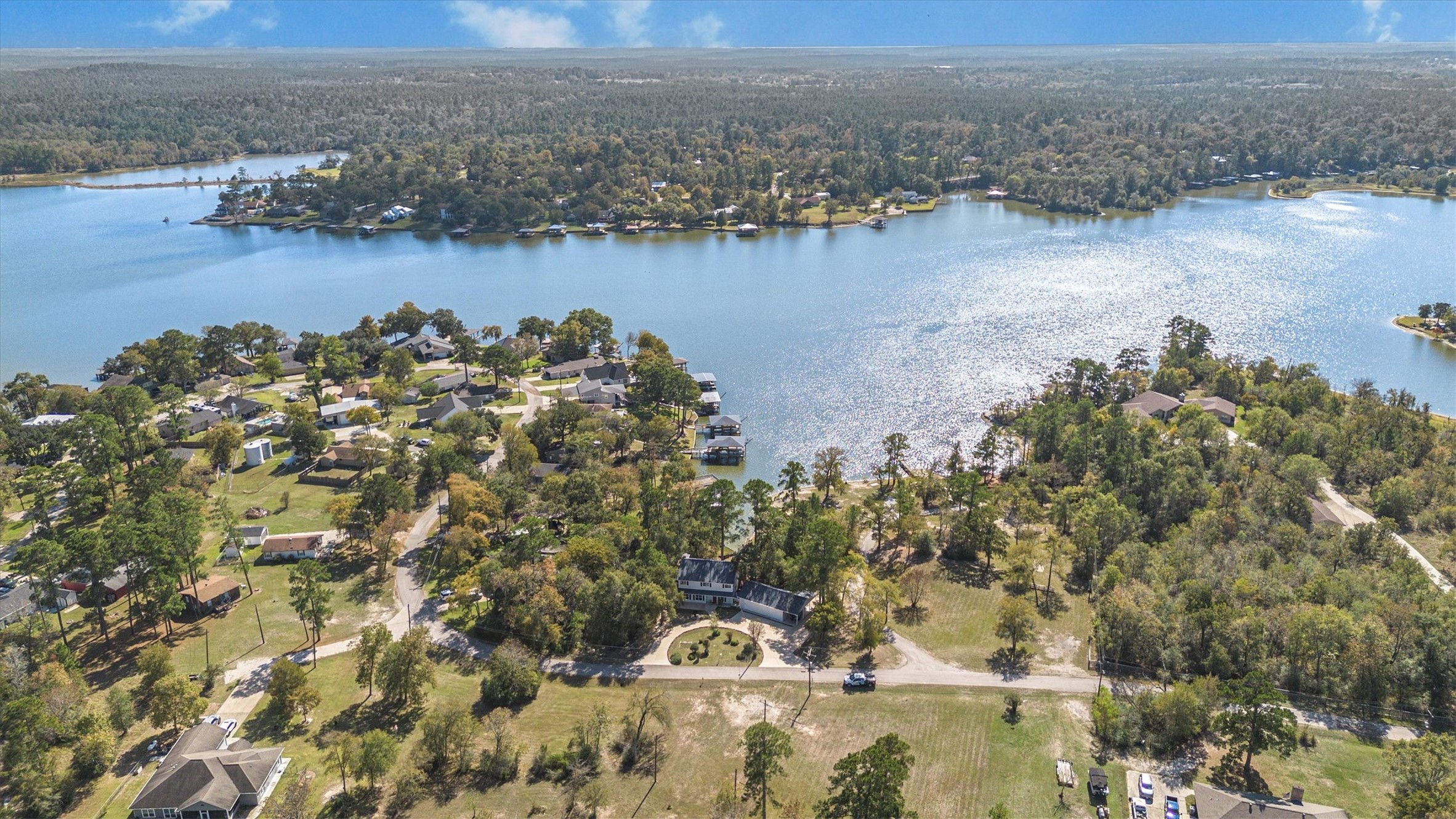 123 Palisade Circle Huntsville, TX 77320 - Photo 9 of 50 a view of a lake from a yard