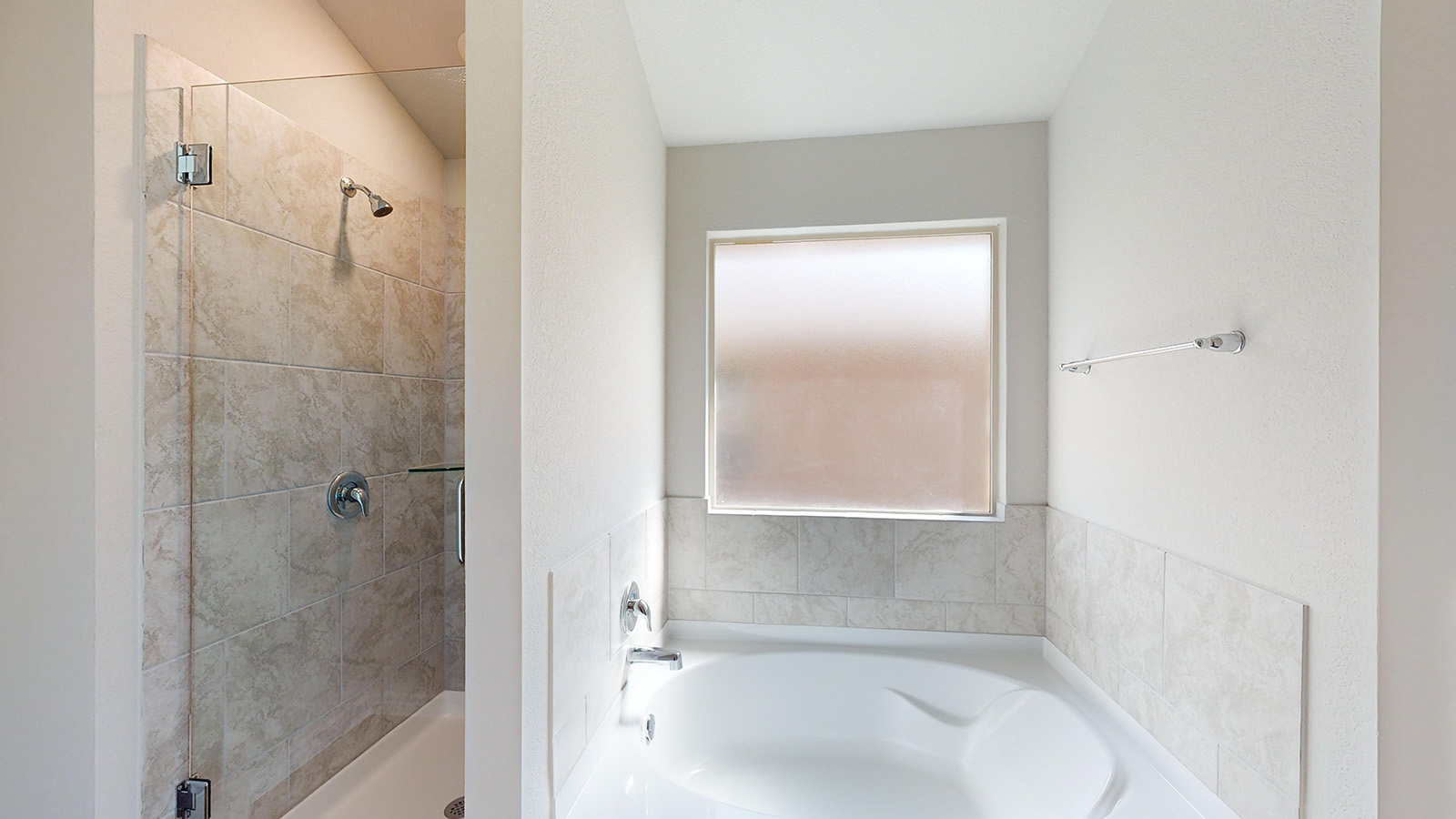 243 Water Wl Road Burnet, TX 78611 - Photo 16 of 23 Soaking tub with a tiled surround and an opaque window