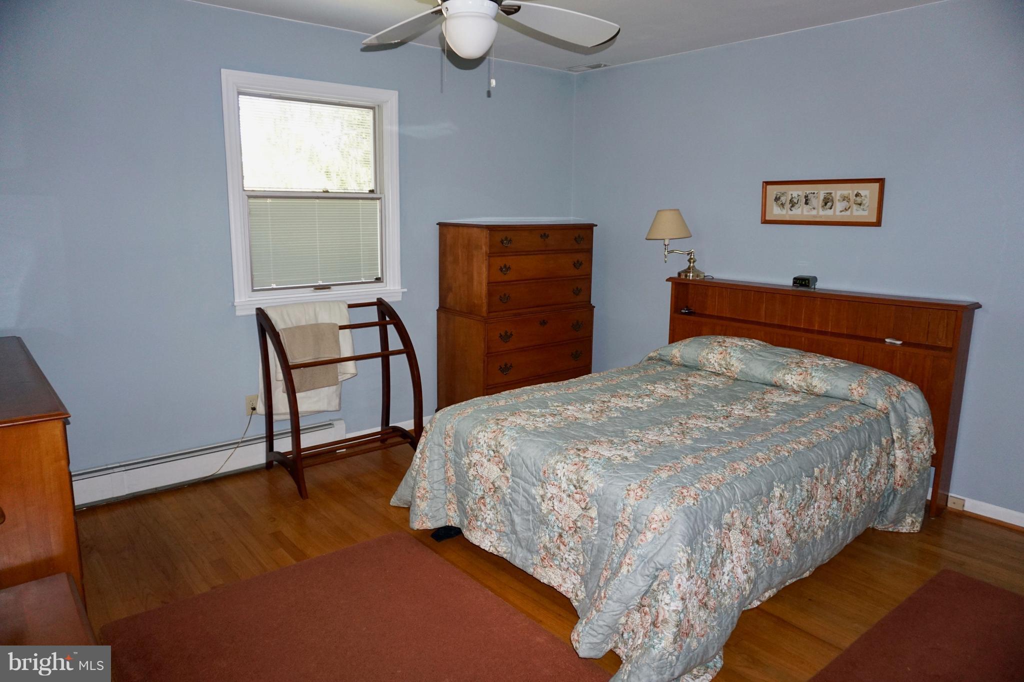 3202 Hunt Road Fallston, MD 21047 - Photo 15 of 29 a bedroom with a bed and a dresser next to it