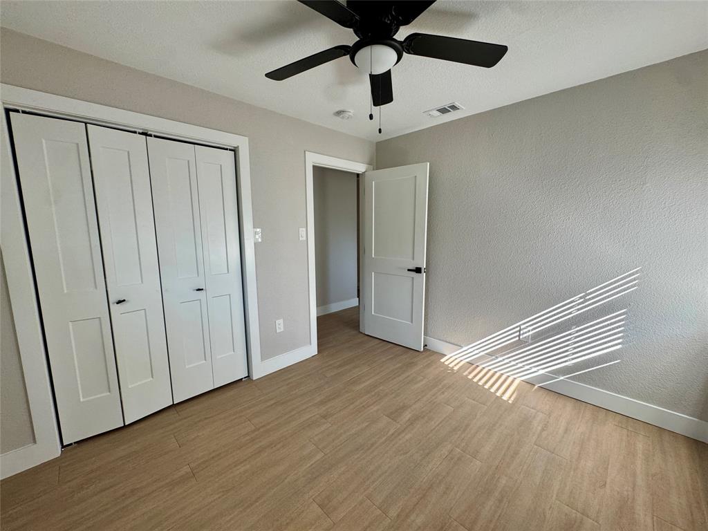 3824 Patman Street Lancaster, TX 75134 - Photo 18 of 24 a view of empty room with wooden floor