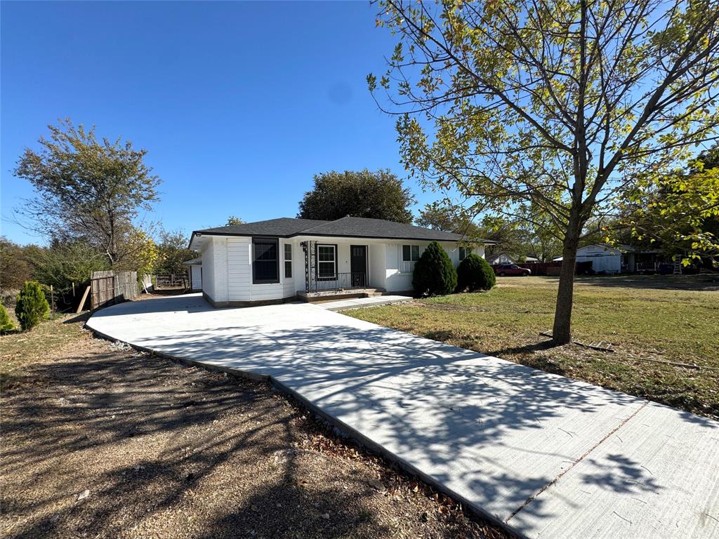 3824 Patman Street Lancaster, TX 75134 - Photo 2 of 24 a view of a house with a yard