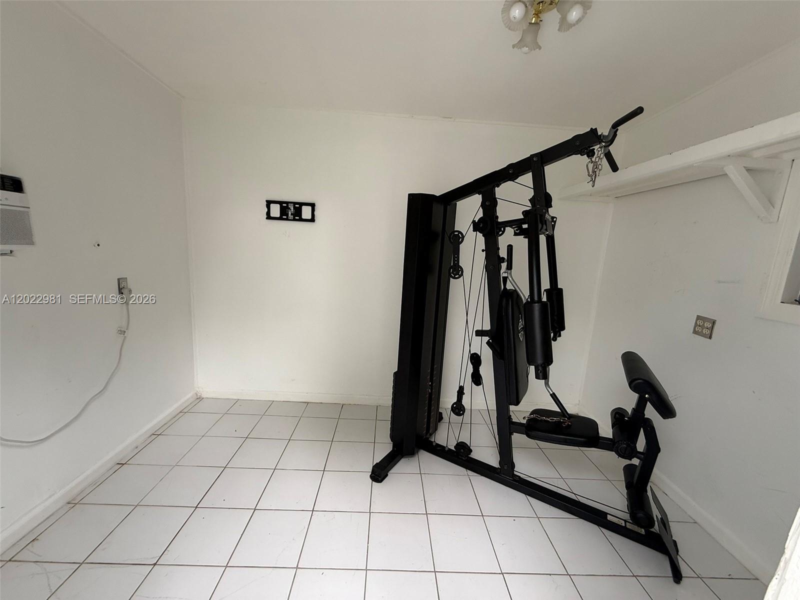 5940 Southwest 2nd Street Miami, FL 33144 - Photo 13 of 22 a view of a room with gym equipment