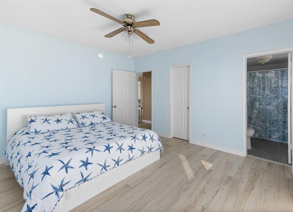 1900 South Ocean Drive, Unit 712 Fort Lauderdale, FL 33316 - Photo 13 of 25 a bedroom with a large bed and a chandelier