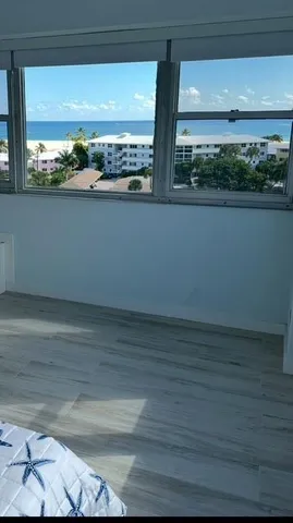 a bathroom with a tub sink and a mirror