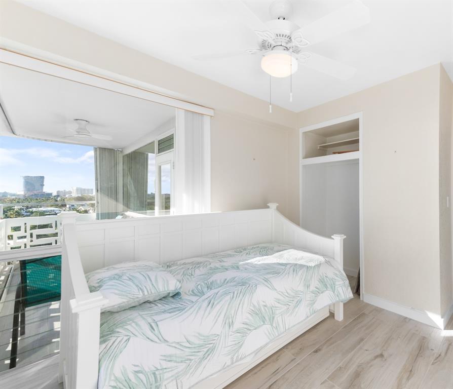 1900 South Ocean Drive, Unit 712 Fort Lauderdale, FL 33316 - Photo 18 of 25 a bedroom with a large bed and ceiling fan