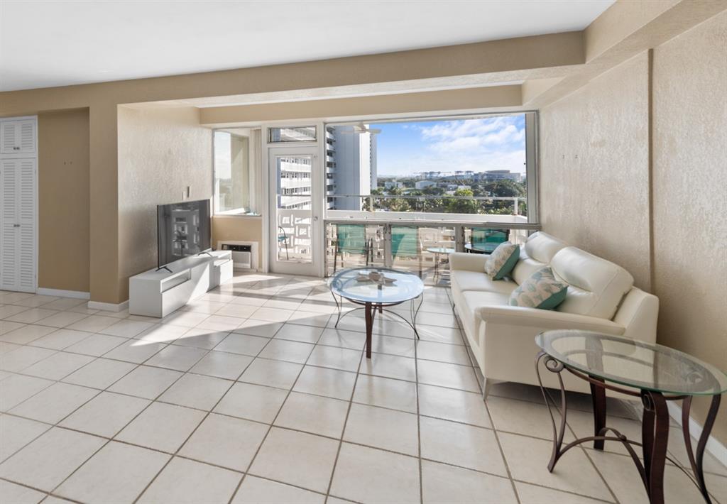 1900 South Ocean Drive, Unit 712 Fort Lauderdale, FL 33316 - Photo 5 of 25 a living room with furniture and a large window