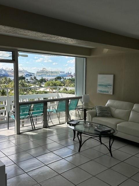 1900 South Ocean Drive, Unit 712 Fort Lauderdale, FL 33316 - Photo 8 of 25 a living room with furniture and a floor to ceiling window