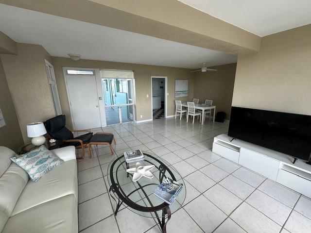 1900 South Ocean Drive, Unit 712 Fort Lauderdale, FL 33316 - Photo 9 of 25 a living room with furniture and a flat screen tv