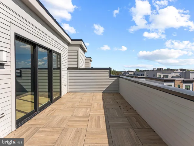 a view of a balcony with wooden floor