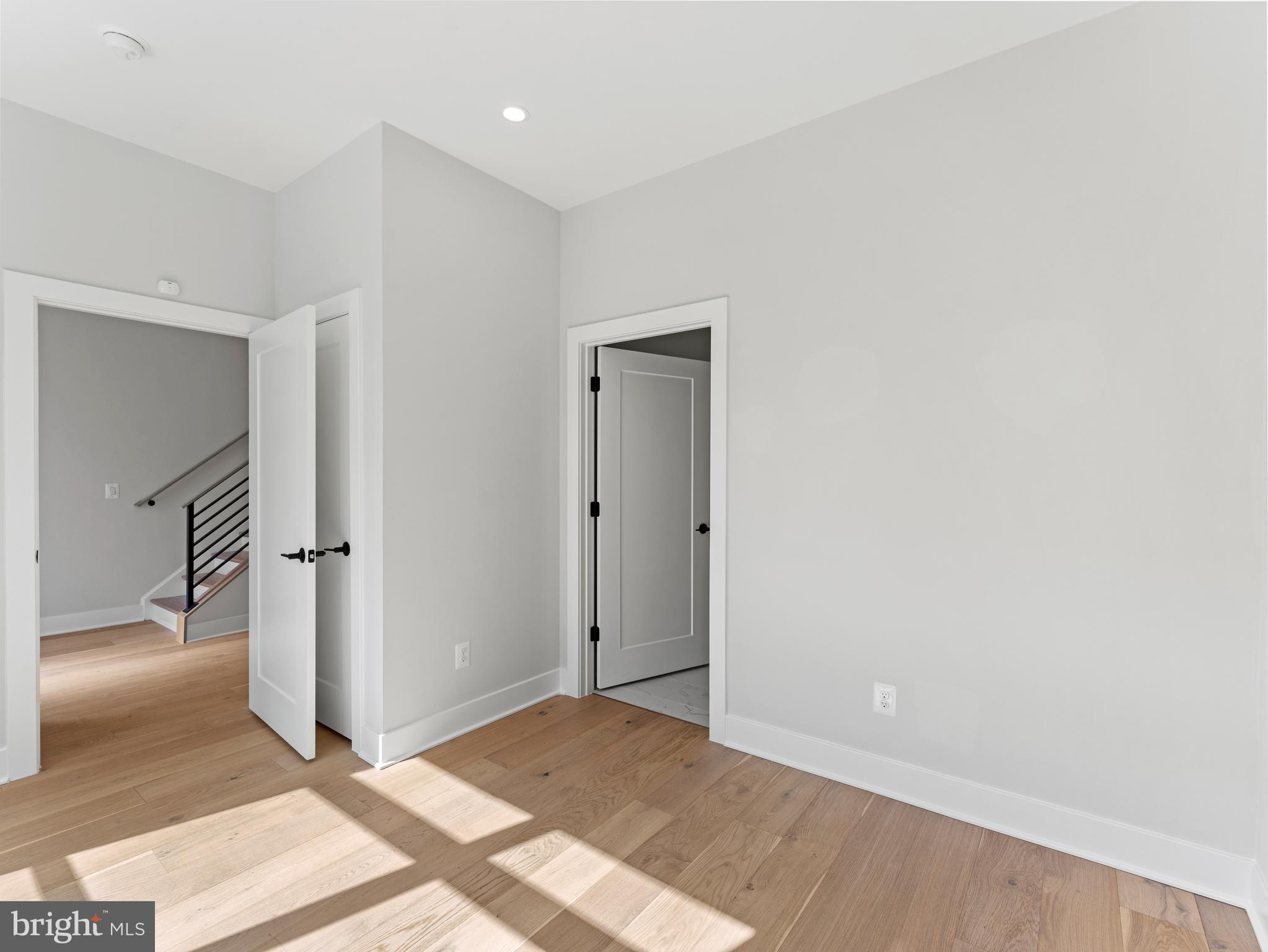 2015 Tysons Ridgeline Road Falls Church, VA 22043 - Photo 5 of 33 a view of a livingroom with wooden floor and a hallway