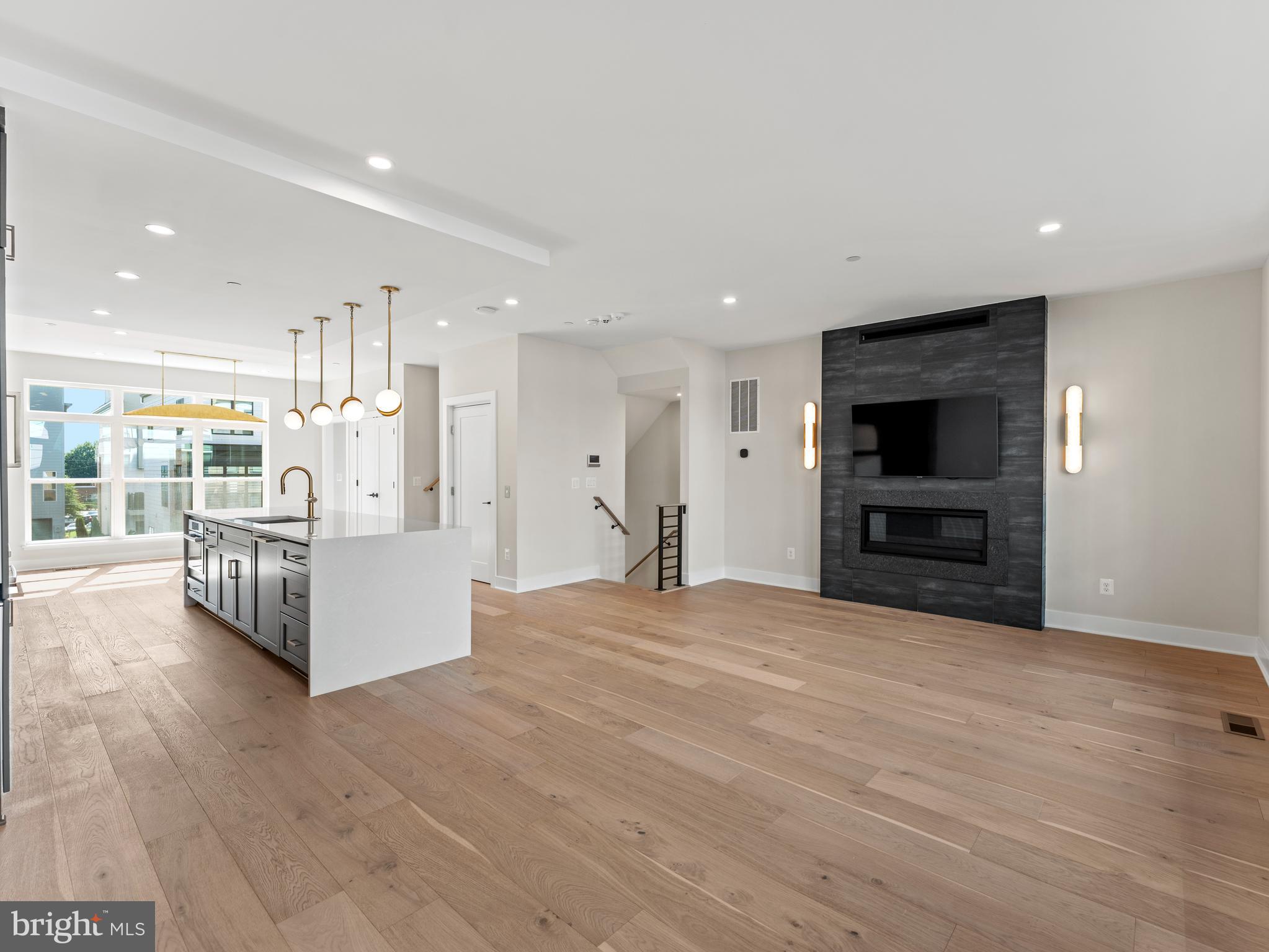 2015 Tysons Ridgeline Road Falls Church, VA 22043 - Photo 8 of 33 a view of an empty room with kitchen and a window