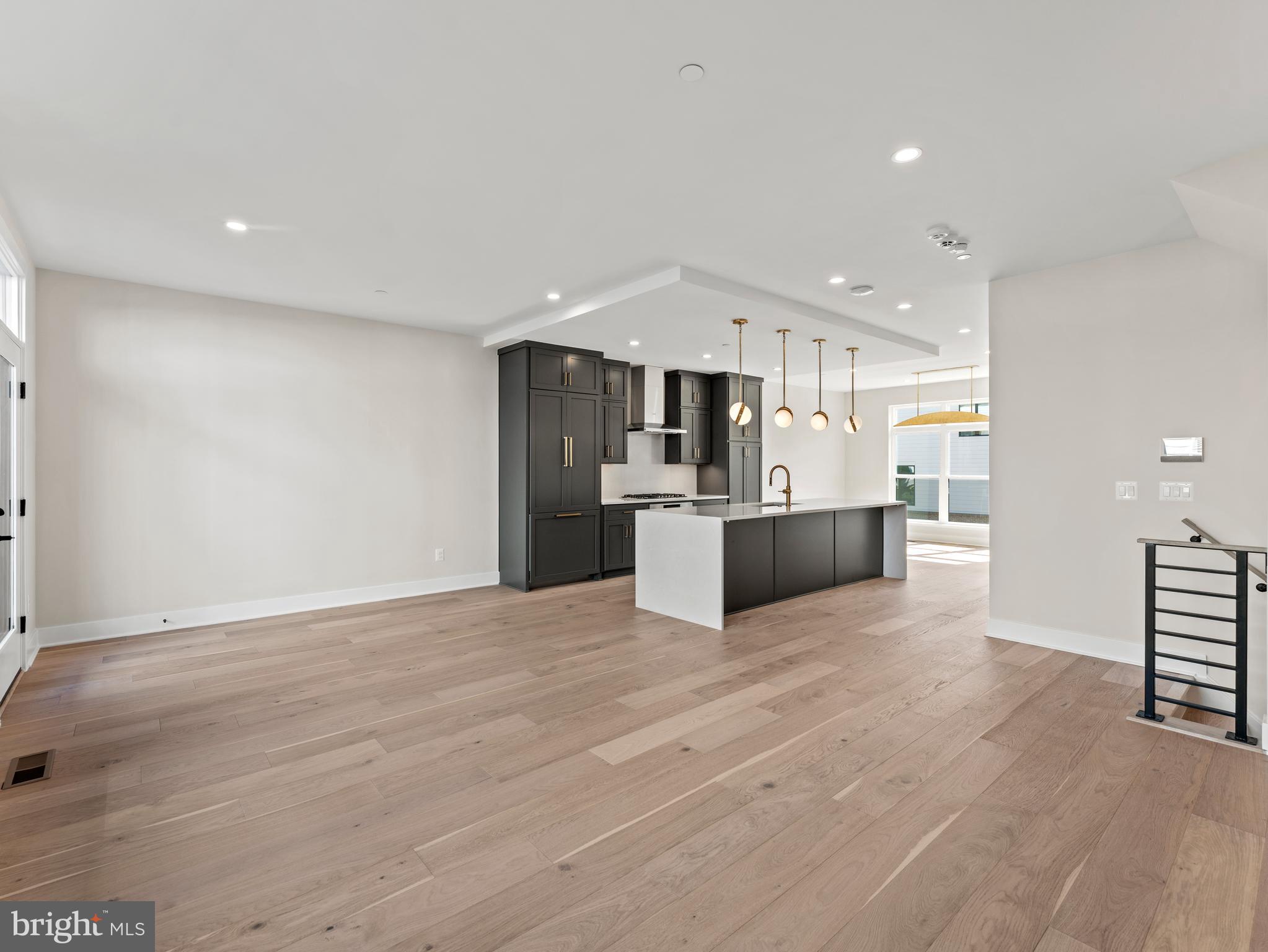 2015 Tysons Ridgeline Road Falls Church, VA 22043 - Photo 9 of 33 a view of kitchen with kitchen island a sink wooden floor and stainless steel appliances