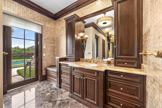 a view of a bathroom with sink and mirror