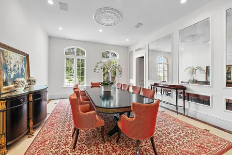 a view of a dining room with furniture and chandelier
