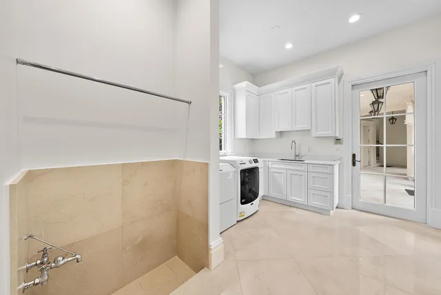 a bedroom with a bed next to a window