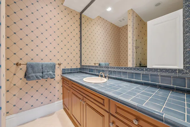 a large spacious bathroom with a large tub sink and window