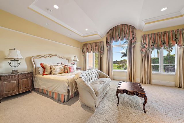 a spacious bedroom with two beds and a couch