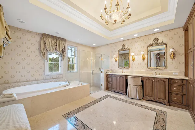 a kitchen with stainless steel appliances granite countertop a sink and a refrigerator
