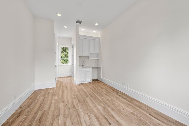 a room with furniture and a large window