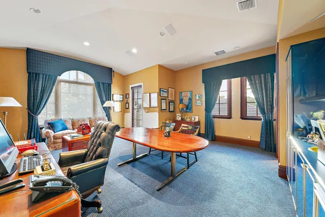 a view of swimming pool with outdoor seating and a garden