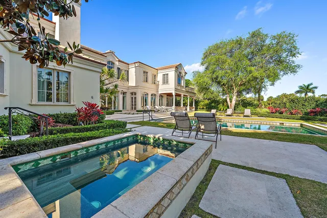 a bathroom with a sink a toilet and a window