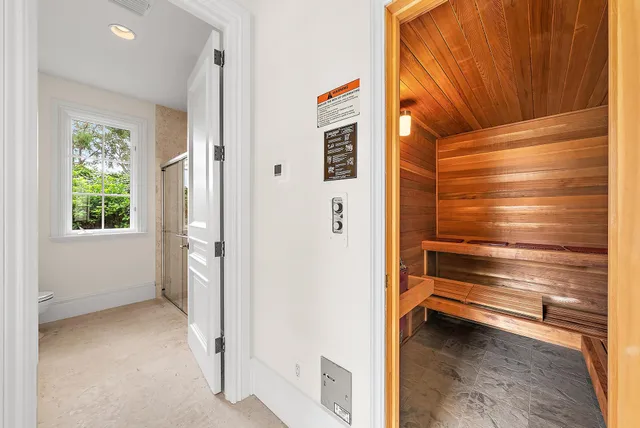 a view of a patio with couches chairs and a fire pit