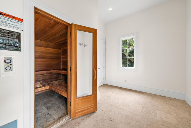 a view of a house with swimming pool and sitting area