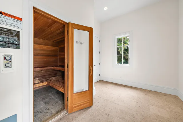 a view of a house with swimming pool and sitting area