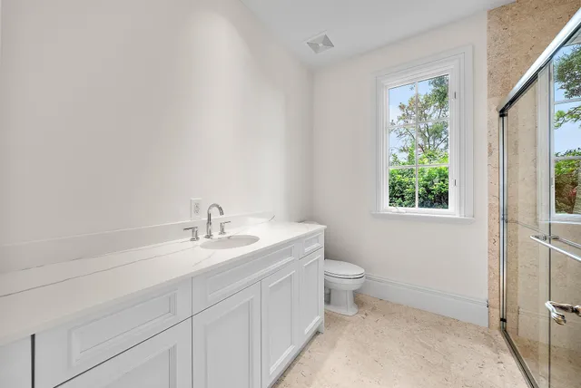 a white bath tub sitting next to a white sink