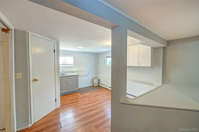 a view of a kitchen cabinets wooden floor and a kitchen