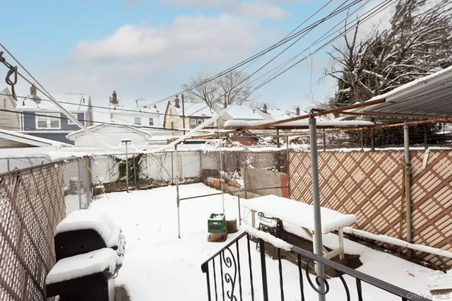 a view of a patio with a table and chairs