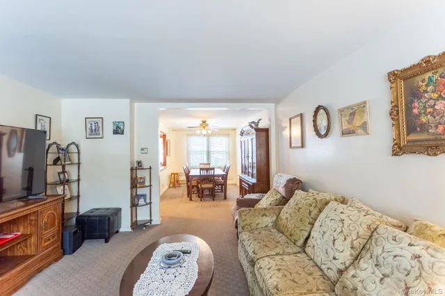 a bedroom with furniture and a flat screen tv