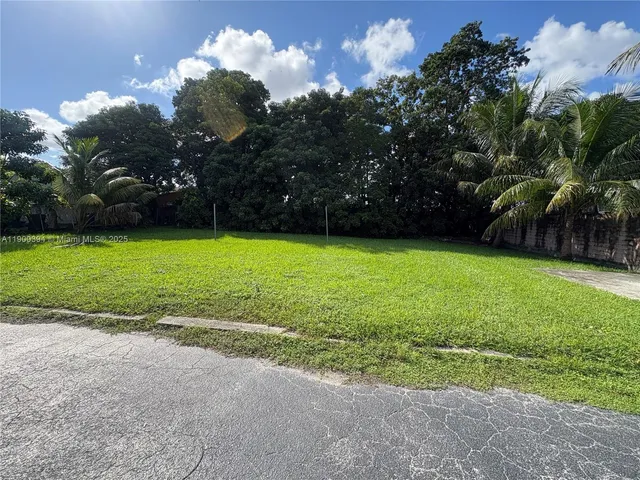 a view of a golf course with a yard