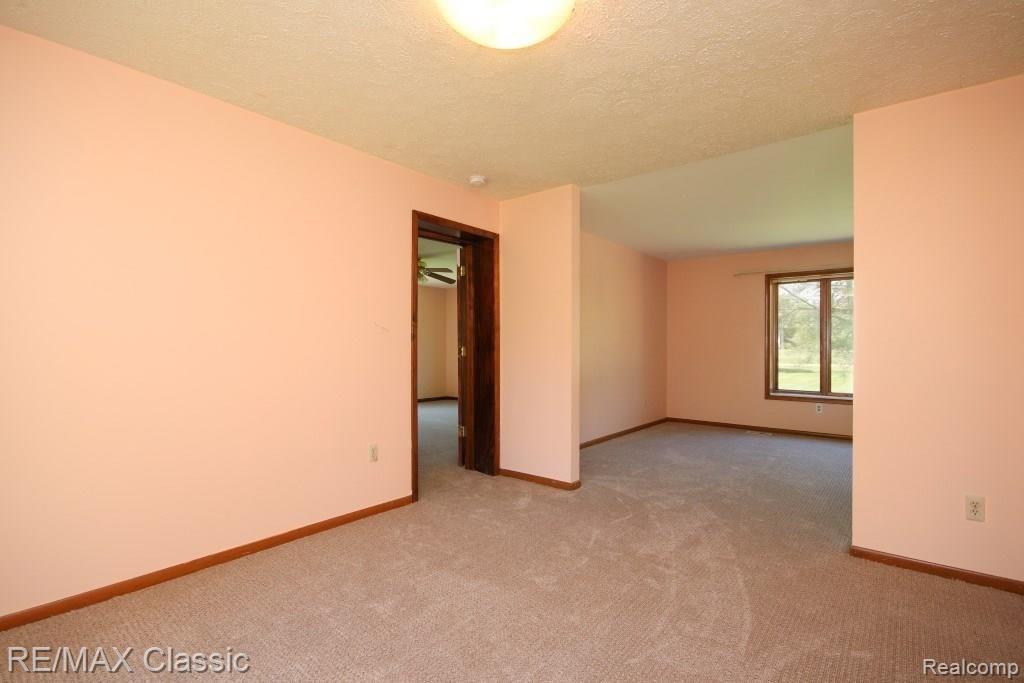 5701 Barr Road Canton, MI 48188 - Photo 14 of 47 Access the main floor bedroom suite from the dining room.