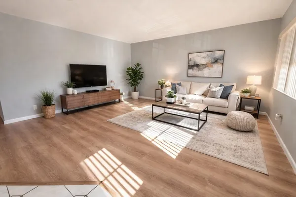 a kitchen with stainless steel appliances a refrigerator a sink a stove top oven a counter space and cabinets