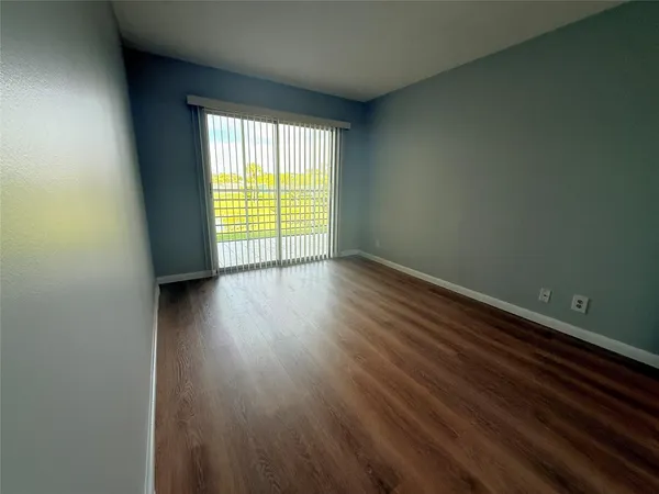 a spacious bathroom with a toilet sink and a mirror