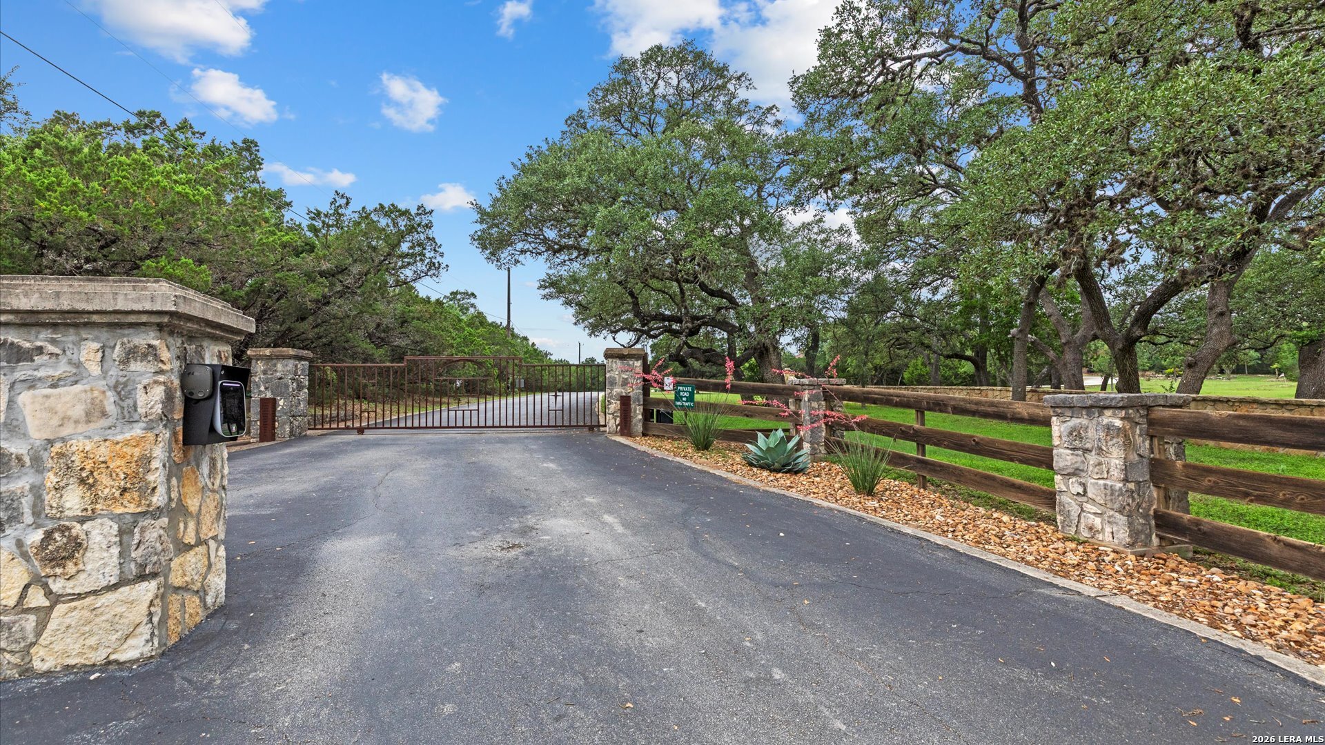 22073 Scenic Loop Road Helotes, TX 78023 - Photo 14 of 27 a view of street with wooden bridge