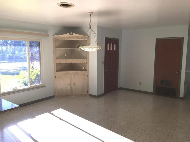 a view of a room that has a window in it