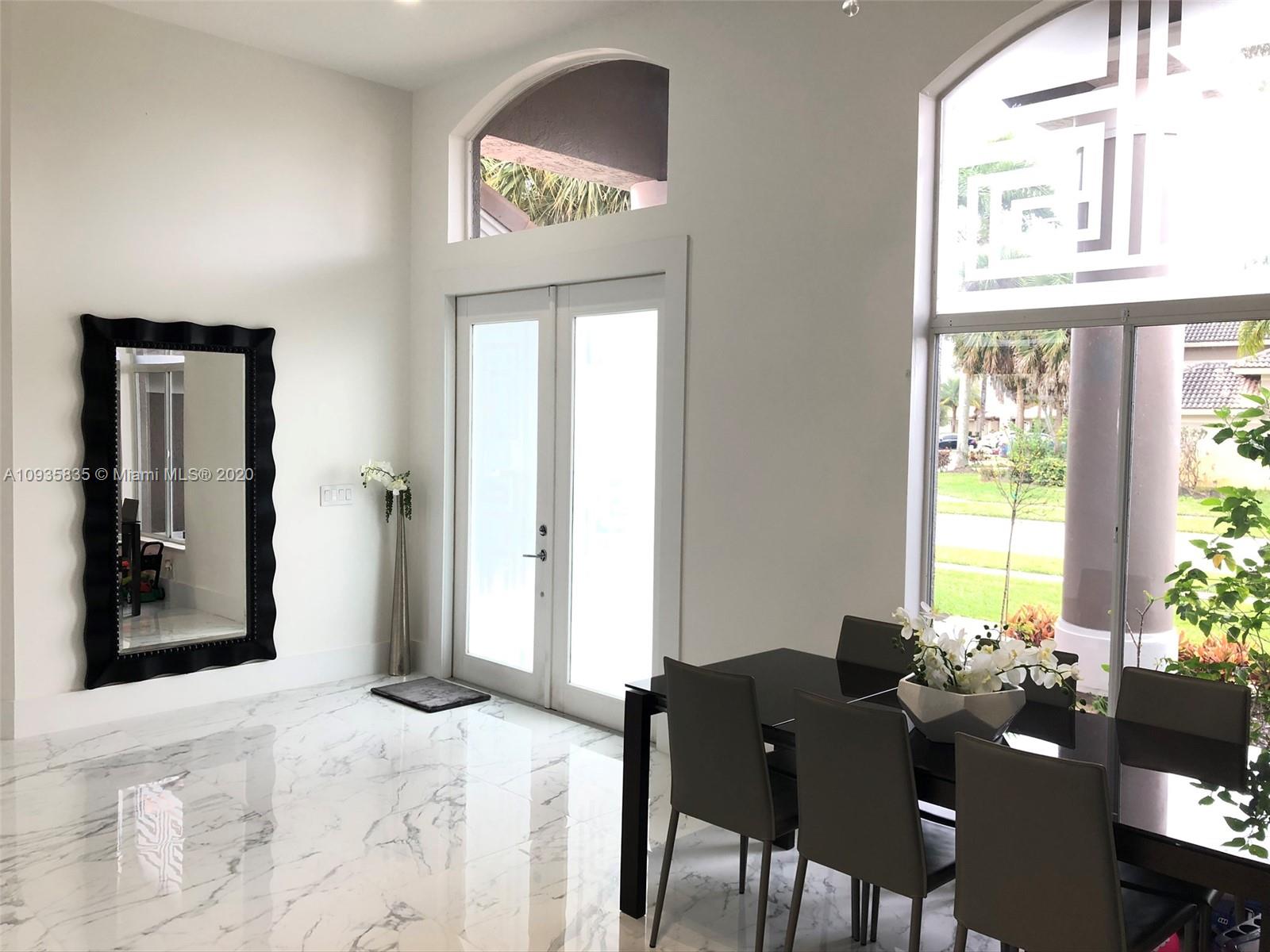 Boca Isles Boca Raton, FL 33498 - Photo 11 of 17 a view of a livingroom with furniture and a window