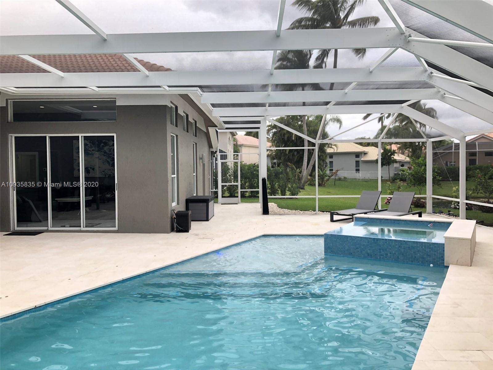 Boca Isles Boca Raton, FL 33498 - Photo 13 of 17 a view of a house with a swimming pool