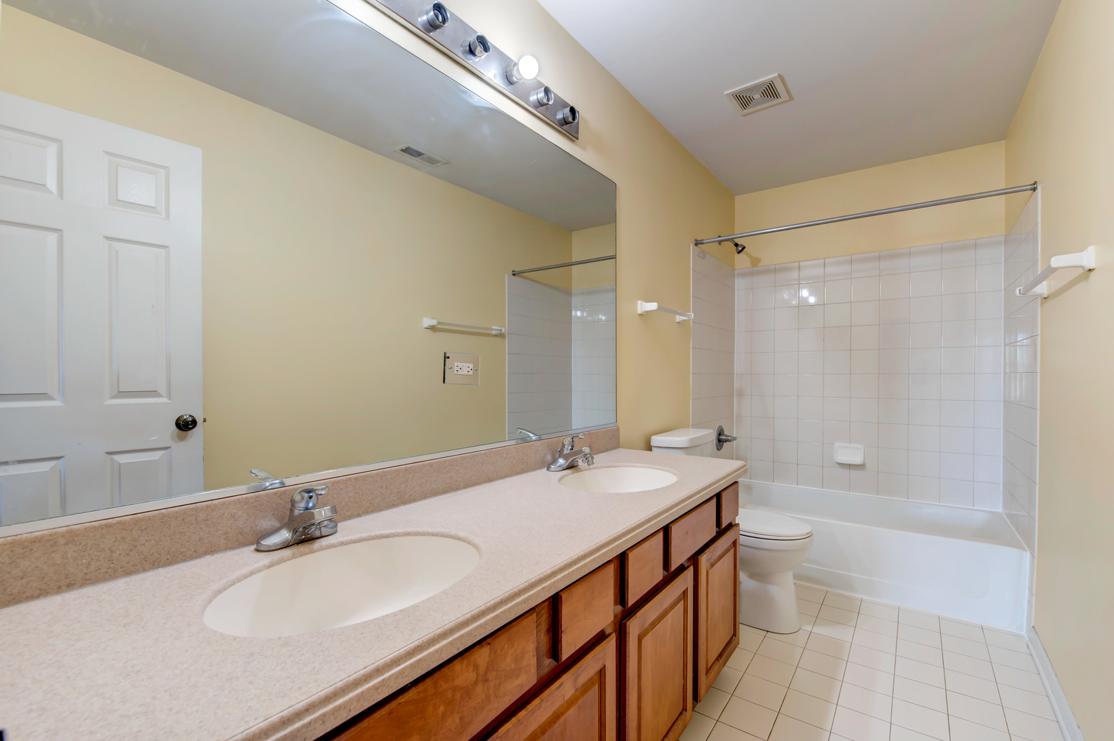 860 Spring Creek Circle Naperville, IL 60565 - Photo 17 of 26 a bathroom with a sink double vanity granite tub shower and a mirror