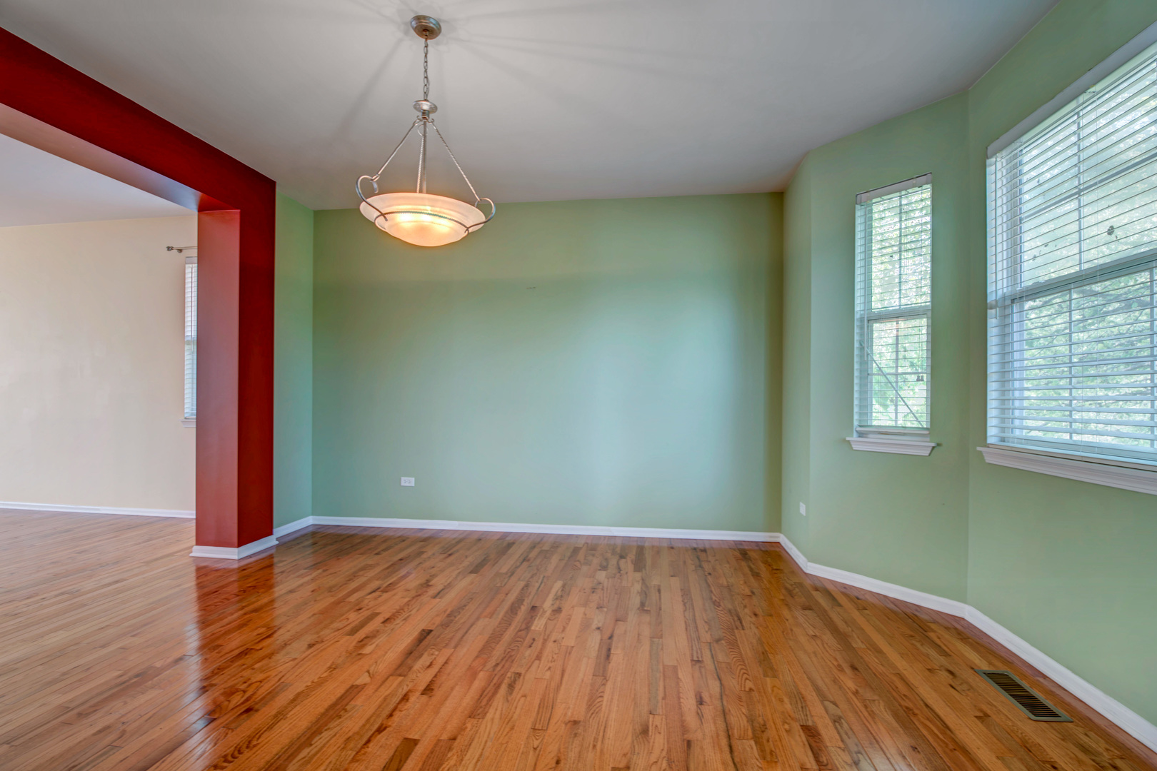 860 Spring Creek Circle Naperville, IL 60565 - Photo 7 of 26 a view of a room with wooden floor and windows