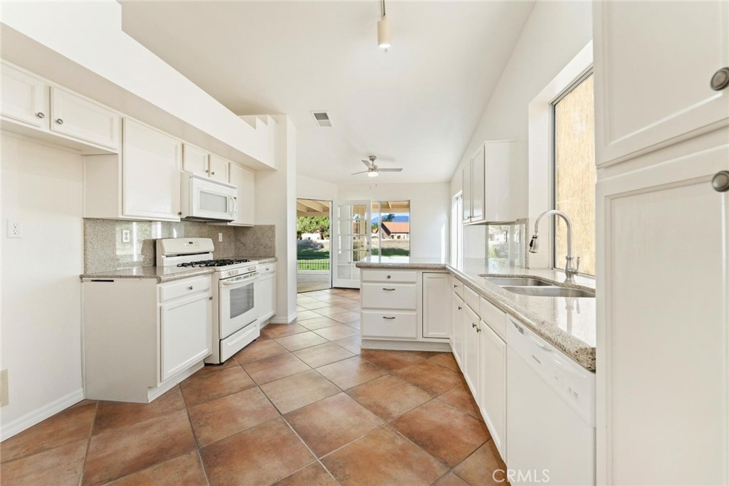 1886 Tamarack Lane Hemet, CA 92545 - Photo 11 of 40 a kitchen with appliances cabinets and a sink