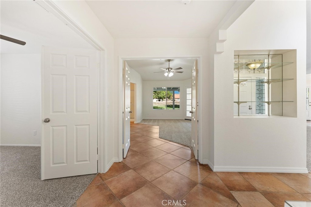 1886 Tamarack Lane Hemet, CA 92545 - Photo 16 of 40 a view of a hallway with wooden floor windows and livingroom
