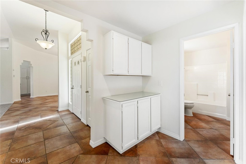 1886 Tamarack Lane Hemet, CA 92545 - Photo 23 of 40 a view of a kitchen with wooden floor and a sink