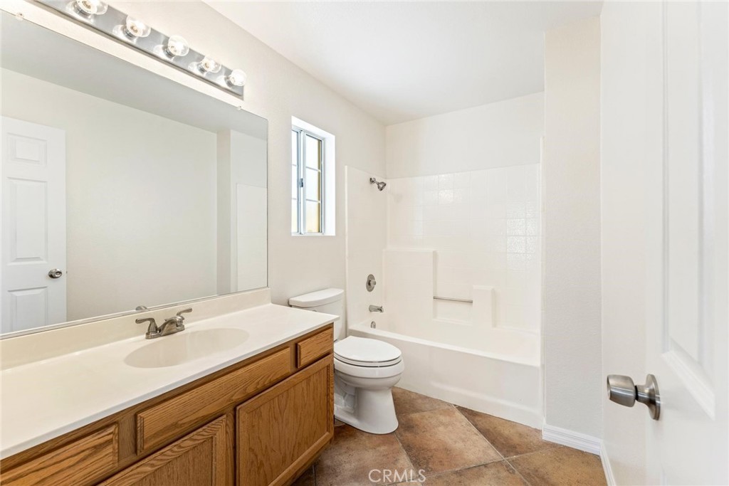 1886 Tamarack Lane Hemet, CA 92545 - Photo 25 of 40 a bathroom with a sink a toilet and shower
