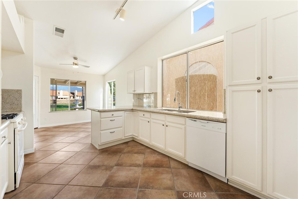 1886 Tamarack Lane Hemet, CA 92545 - Photo 10 of 40 a large white kitchen with a large window