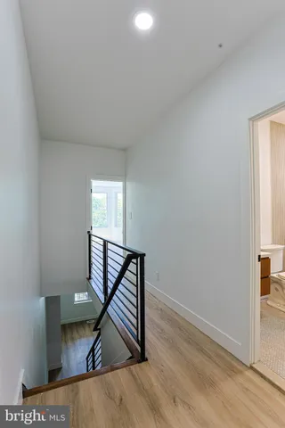 a view of an entryway with wooden floor