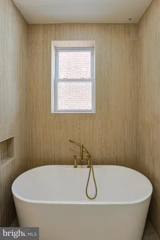 a white bath tub sitting in a bathroom